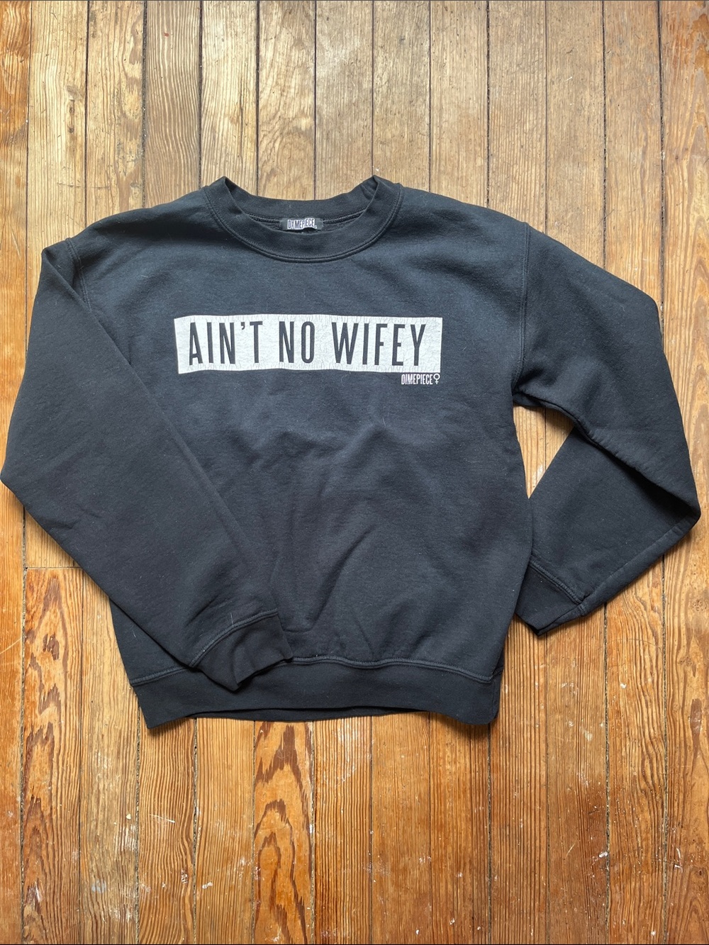 Dimepiece Black Crewneck Sweatshirt with White 'Ain't No Wifey' Graphic